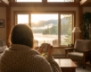 Person wrapped in a blanket at a sunlit window symbolizing hope during cocaine withdrawal and recovery in Canada