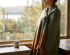 Person in recovery from fentanyl addiction looking out a window with hope in a calm Canadian home